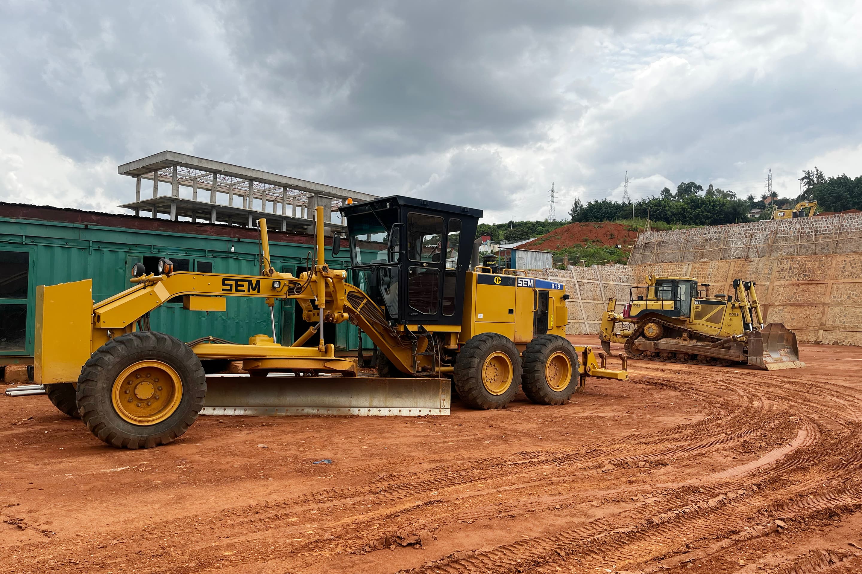 Motor grader levelling a road platform