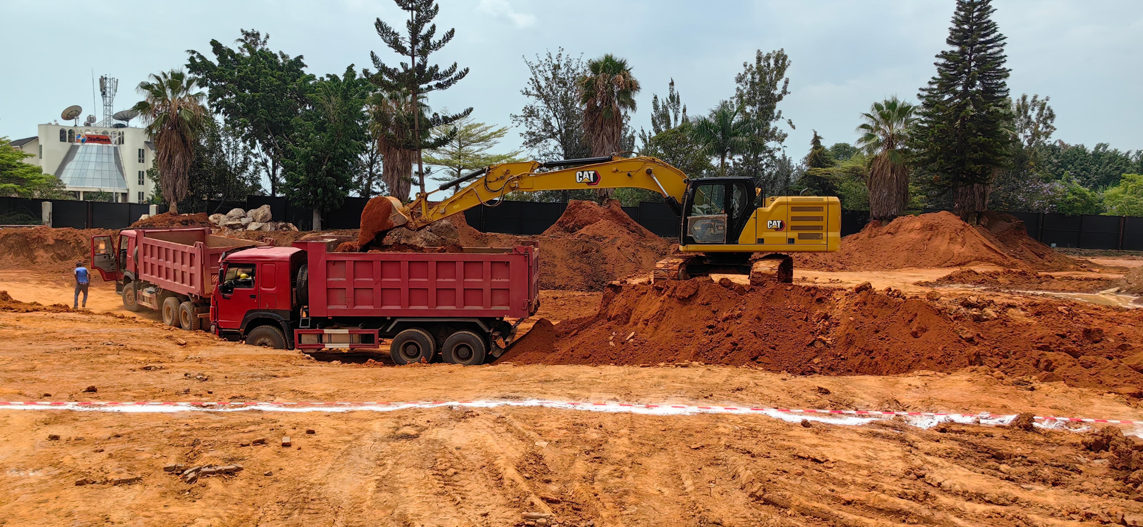 Excavator loading a tipper truck during earthworks